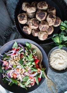 This Lamb Kefta is an easy, nourishing meal my whole family loves. Serving it with the Tomato Salad & Tahini Sauce is a match made in heaven.