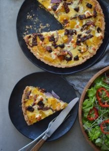 This Pumpkin, Goat Cheese, Sun-dried Tomato Quiche recipe has a delicious combination of ingredients. Bonus you can eat it hot or cold!