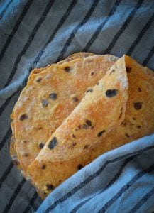 These Sweet Potato Roti Flatbreads are a quick and easy wrap to make. Great warm as a side with a curry or store and use for school lunches.