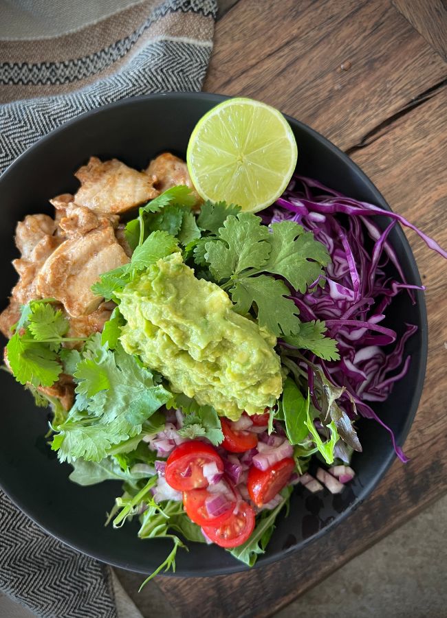 Introducing a family favourite – the Mexican Chicken Nourish Bowl! This nourishing meal is quick and easy to make, and is often prepared by my kids when it’s their turn to cook. Packed with warming and antioxidant spices, healthy fats, and a colourful assortment of fibre rich vegetables, this bowl is a delicious and nutritious way to fuel your day.