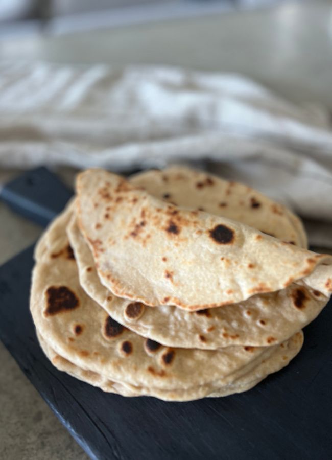 These soft, chewy sourdough naan breads not only use up leftover discard, they are delicious and versatile.