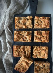 We have a LOT of Anzac inspired recipes already, but when this Anzac Caramel Slice came to mind, I thought why not, caramel in an Anzac biscuit base has got to be good.