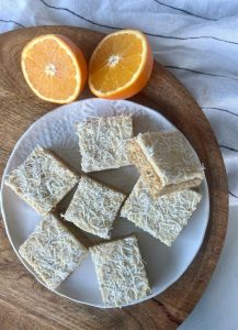 This easy and delicious Orange Coconut Slice is a perfect wintery choice for a sweet treat, when oranges abound and we need some fruity sunshine in our afternoon! This slice uses almond meal as a higher protein flour, oats for a low GI energy source and shredded coconut for some healthy fats.