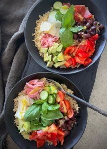 This Mediterranean quinoa bowl is a light, delicious meal packed with fresh veggies, creamy avocado and a tasty dressing.