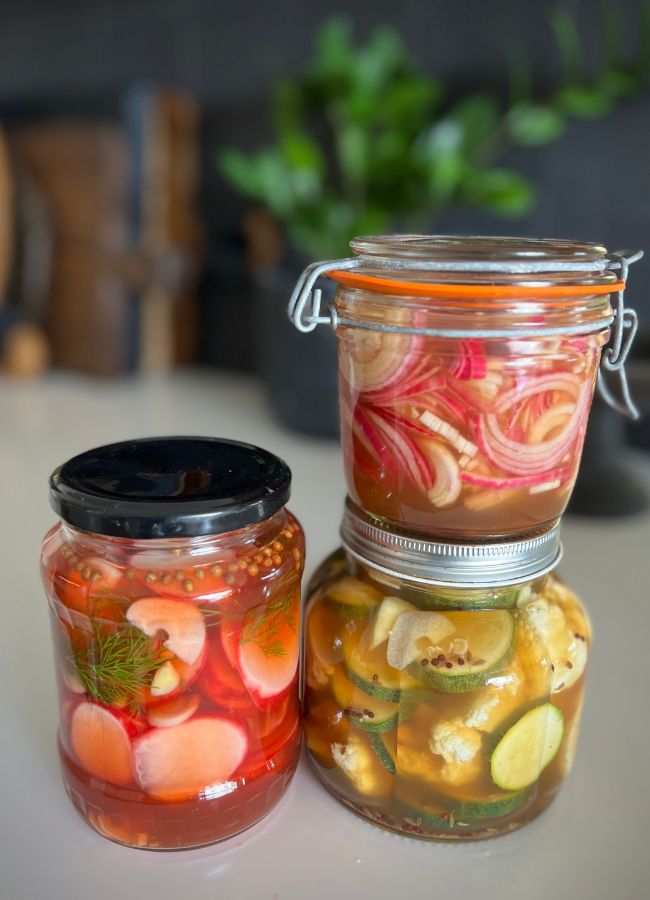Colorful easy pickled vegetables in jars, a tangy and crunchy addition to any meal.