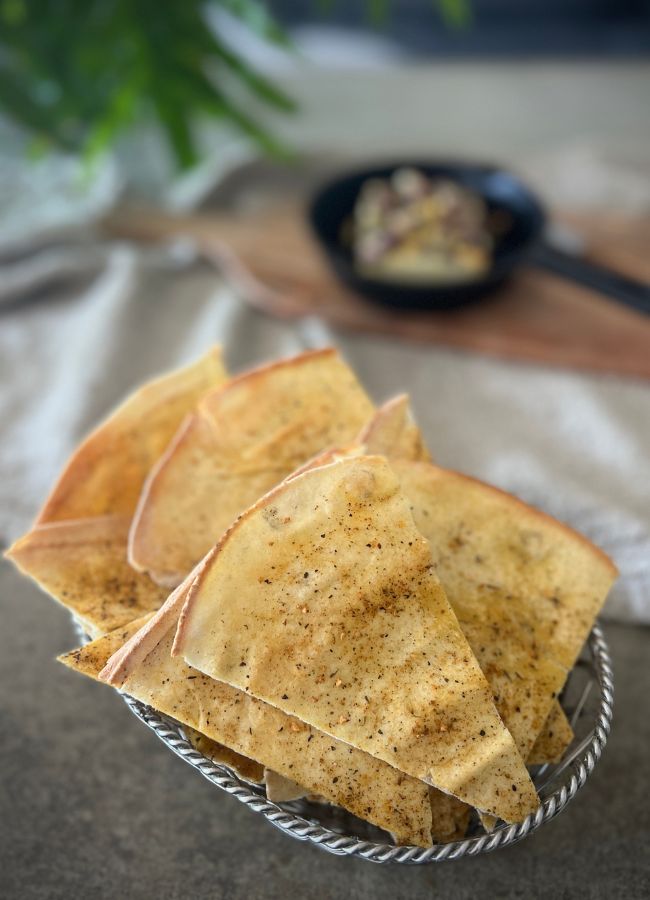 Easy homemade pita chips, golden and crispy, perfect for dipping or snacking.