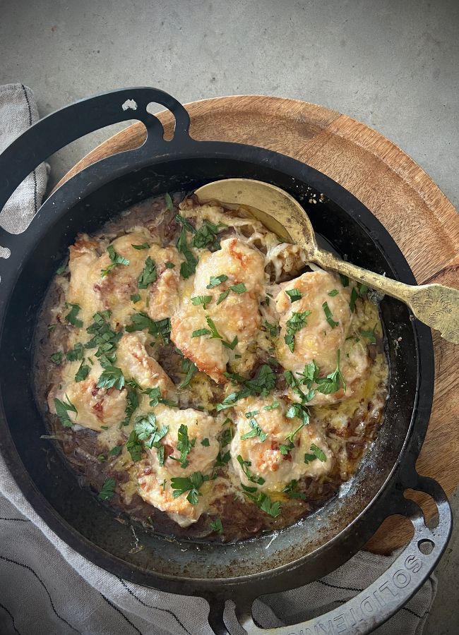 One-pan French onion chicken combines chicken thighs with rich, caramelized onion sauce & melty parmesan cheese. It's quick & easy to make.