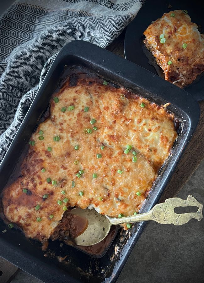 Discover this best and most wholesome Healthy Greek Moussaka recipe with layers of roasted eggplant, rich meat sauce, and creamy béchamel.