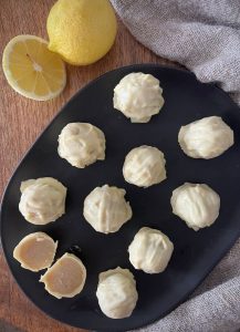 Zesty lemon white chocolate truffles made with wholesome ingredients like almond meal & coconut oil. Easy to make and perfect for gifting!