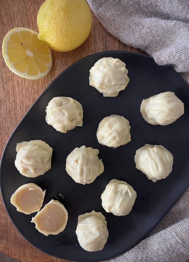 Zesty lemon white chocolate truffles made with wholesome ingredients like almond meal & coconut oil. Easy to make and perfect for gifting!