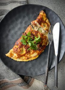 This protein-packed chicken omelette is quick to make, full of flavour, and a great way to start your day with 55g of protein. The combination of chicken, tamari, and fresh greens makes it both nutritious and satisfying.