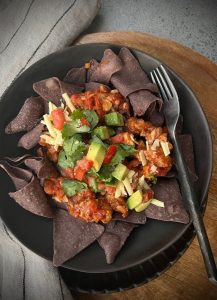 These Quick Chicken Nachos are an easy, family-friendly dinner with Mexican-spiced chicken, fresh salsa, and all your favourite toppings.