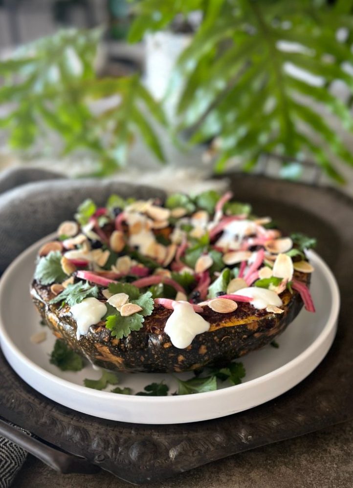 This roast spiced pumpkin with pickled onion, spiced yoghurt sauce & fresh herbs is bursting with flavour, gut-friendly ingredients & spices