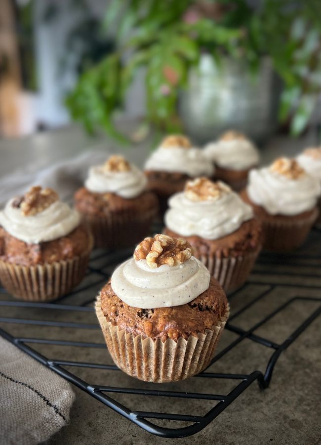 These healthy carrot cake muffins are moist, packed with protein, fibre & nourishing wholefood ingredients with cream cheese yoghurt frosting.