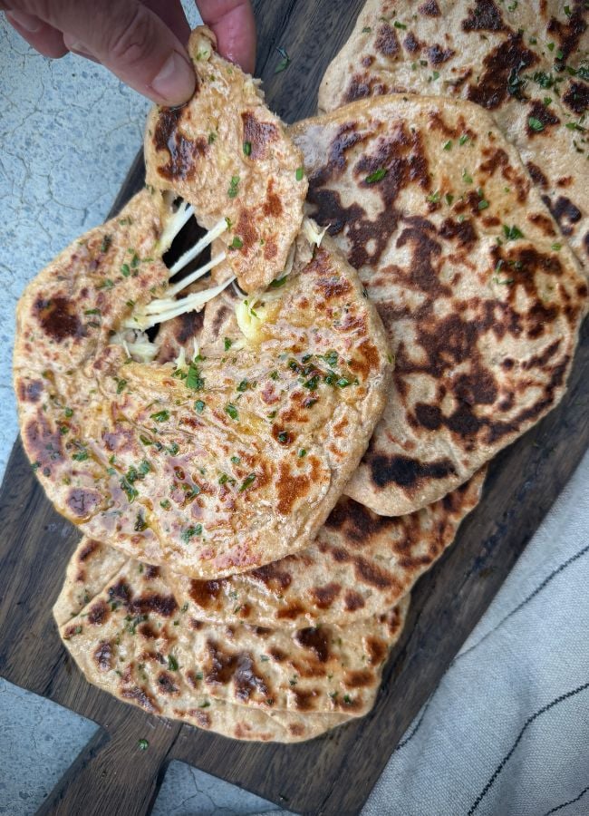 Easy homemade cheese naan are soft, fluffy, cheesy flatbread that's perfect with curries, soups and family meals.